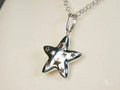 Celestial Radiance: White Gold Star Pendant