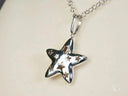 Celestial Radiance 18k white gold star pendant with shiny silver cut-outs