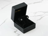 Celestial Spark 18k white gold star CZ earrings in black box