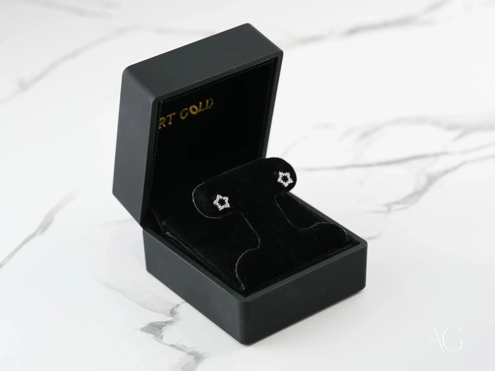 Celestial Spark 18k white gold star CZ earrings in black box