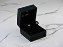 Charming Bow 18k gold CZ heart bow earrings in open black velvet box