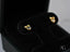 Gold CZ Heart Bow Earrings featuring heart-shaped gemstones in charming bow design