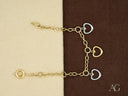 18k yellow art gold jewelry: enchanting bracelet combines hearts and chains