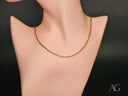Delicate 18K gold chain necklace on mannequin, art gold jewelry