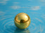 Reflective spherical gold object in Classic Elegance 18K Gold Ball Stud Earrings art gold jewelry