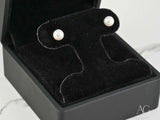 Classic Lustre 18k gold pearl stud earrings in black velvet box