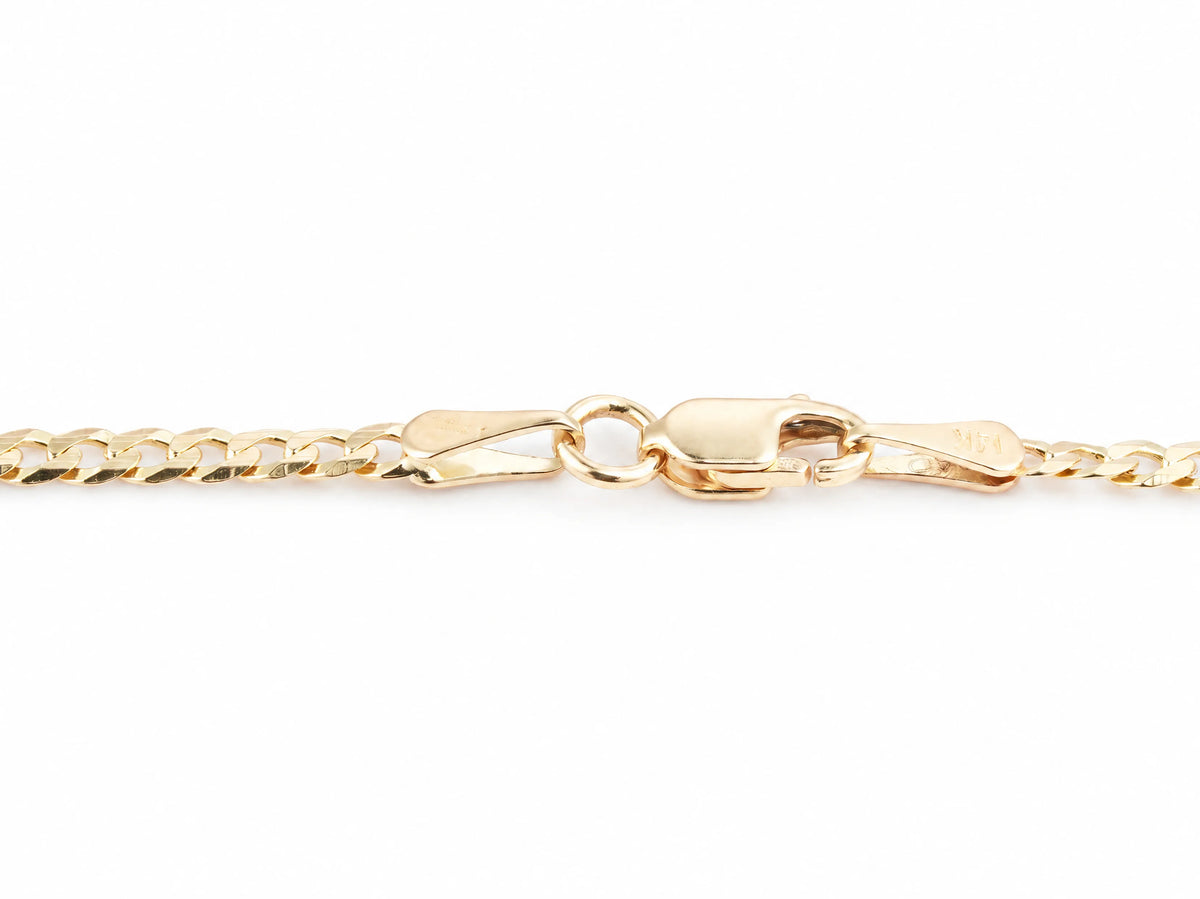 Lobster clasp and end tag on the 14K yellow gold Cuban chain