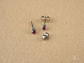 Crimson Radiance: 18k White Gold CZ Stud Earrings
