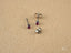 Silver-colored stud earrings with small red gemstones from Crimson Radiance art gold jewelry