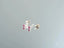 Silver stud earrings with fuchsia gemstones from Crimson Radiance art gold jewelry collection