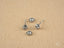 Four loose cubic zirconia stud earrings with screw-back posts in art gold jewelry style