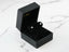 Black jewelry box with certified 18k solid gold diamond stud earrings from Crown Jewel