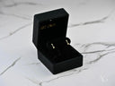Cupid’s Arrow 18k gold CZ arrow stud earrings in black box with push-back clasp