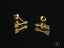 Cupid’s Arrow art gold jewelry featuring gold arrow-shaped stud earrings with pavé diamonds