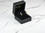 Open black jewelry box showcasing Dazzle Duo 18K Gold Double CZ Earrings with pearls
