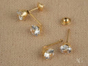Dazzle Duo 18K gold double CZ earrings with faceted gemstones
