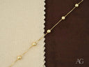 Delicate solid 18k gold bracelet with polished gold spheres