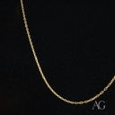 Delicate 18k gold chain necklace with oval links embracing understated luxury