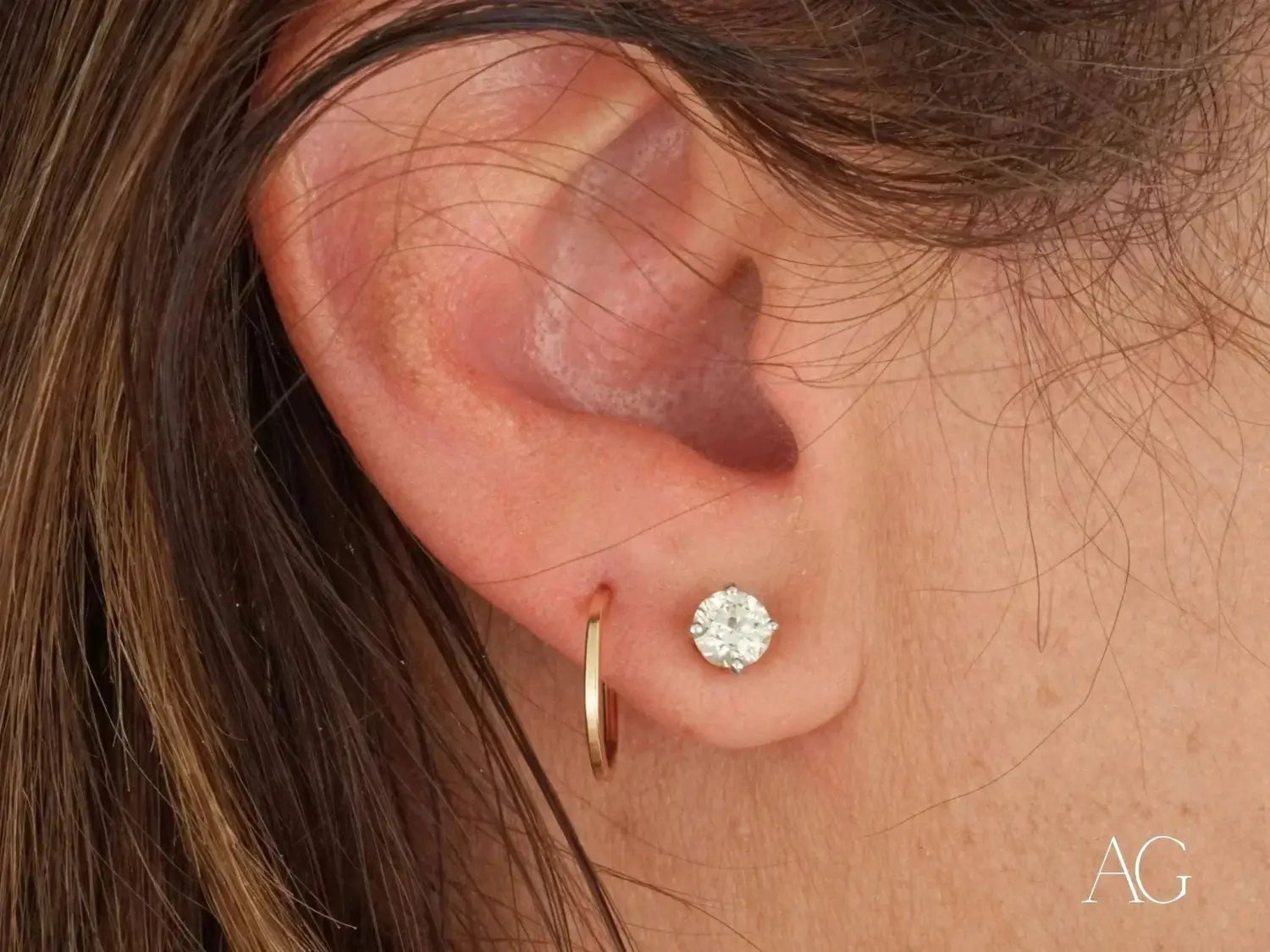 Gold hoop earring with diamond stud in art deco jewelry style
