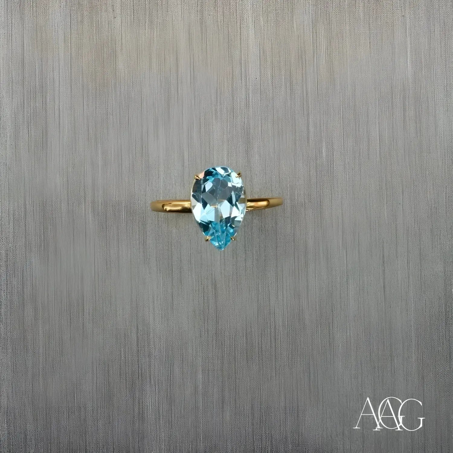 gold geometric ring with clear stones on white card showcasing fine jewelry in 18k gold for luxury jewelry guide