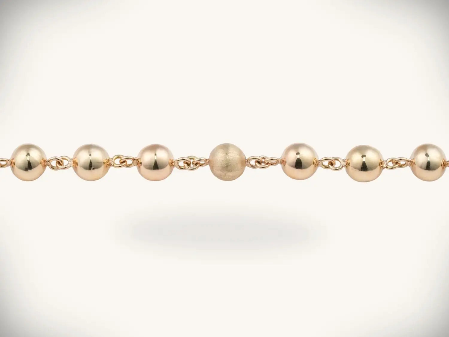 two silver-toned polished wedding bands reflecting fine jewelry elegance in his-and-her gold jewelry pairings