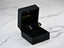 Gold CZ heart drop earrings with white pearl in an open black velvet jewelry box