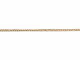 14K yellow gold Cuban chain laid flat, interlocking curb links catching the light