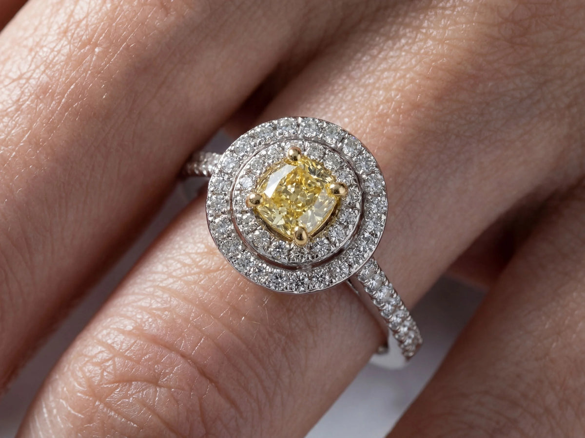 Detailed close-up of double halo engagement ring center stone and surrounding diamonds