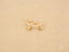Gold stud earrings with clear stones and heart-shaped backs from Diamond Cross Earrings collection