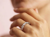 Diamond half-band wedding ring with nine graduated stones, close-up side view