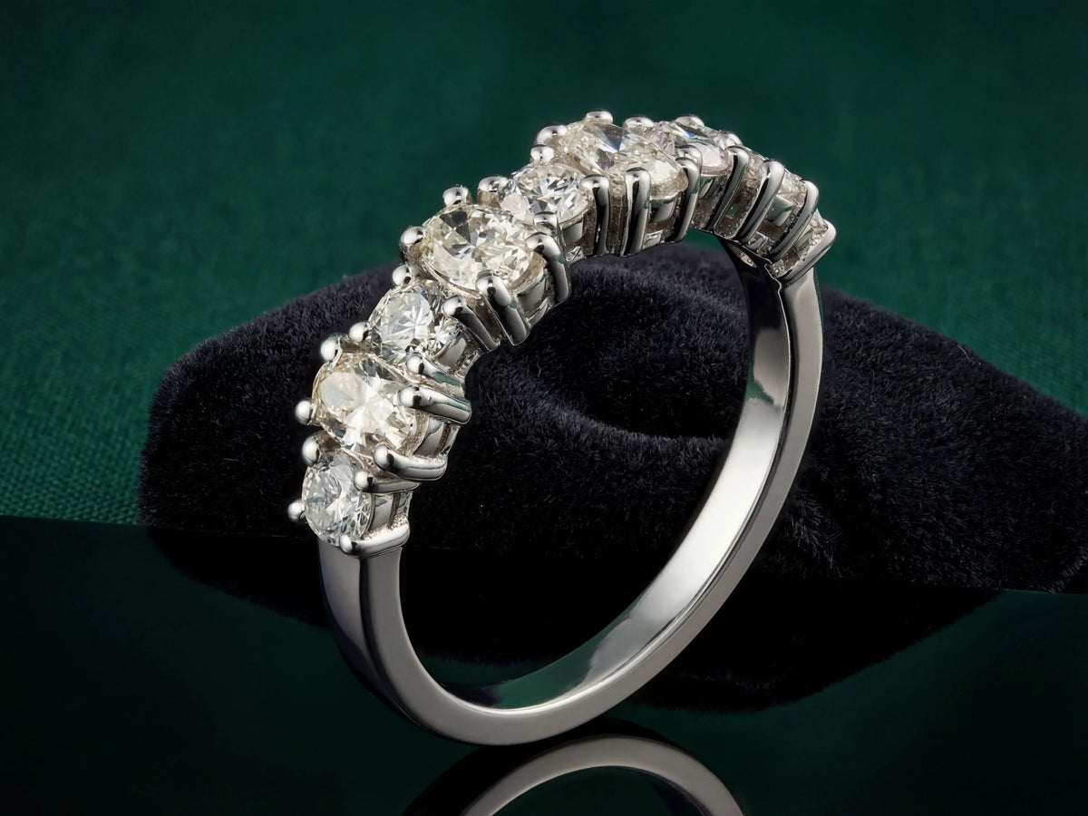 Diamond half-band wedding ring with nine graduated stones, elevated side view