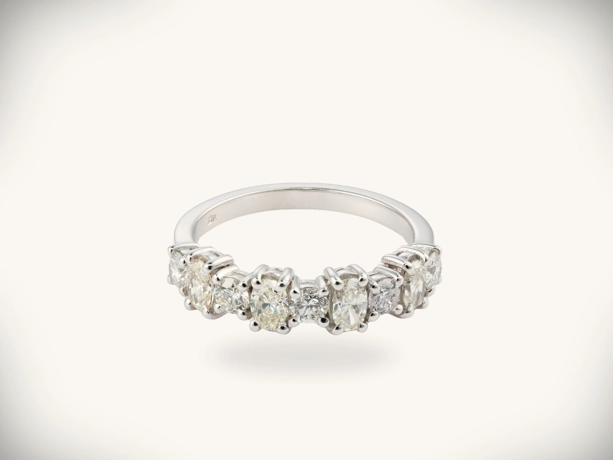Diamond half-band wedding ring with nine graduated stones, face-on front view