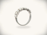 Diamond half-band wedding ring with nine graduated stones, side profile view
