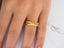 Diamond Tapestry gold wedding band with textured cross-hatch art gold jewelry design