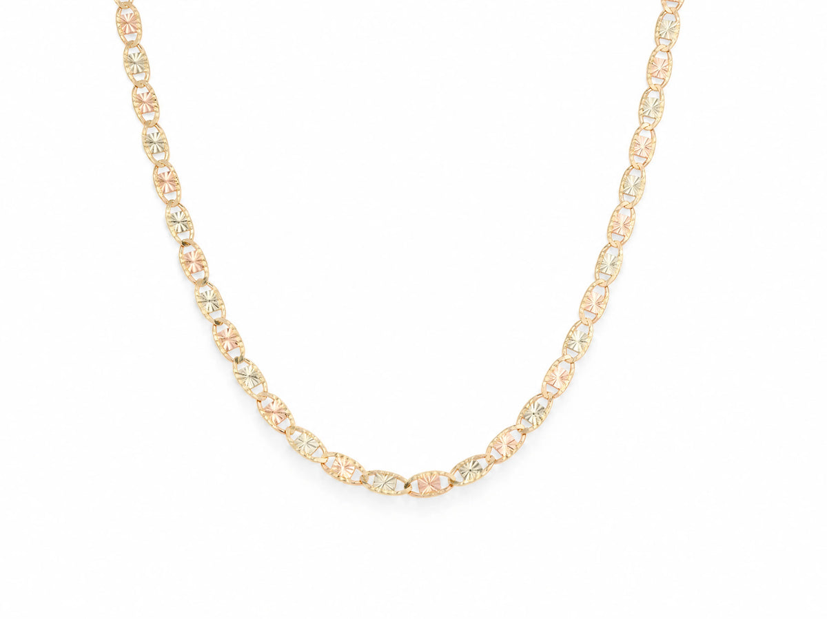 14K tri-colour piastrine chain in a U drape, yellow gold oval frames with plates alternating rose and white gold, diamond-cut rosette pattern