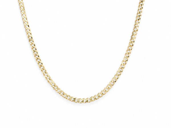 14K yellow gold Cuban chain laid in a U shape on a white background, flat interlocking curb links