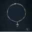 Silver-toned paperclip chain anklet with jumping dolphin charm, perfect marine grace jewelry