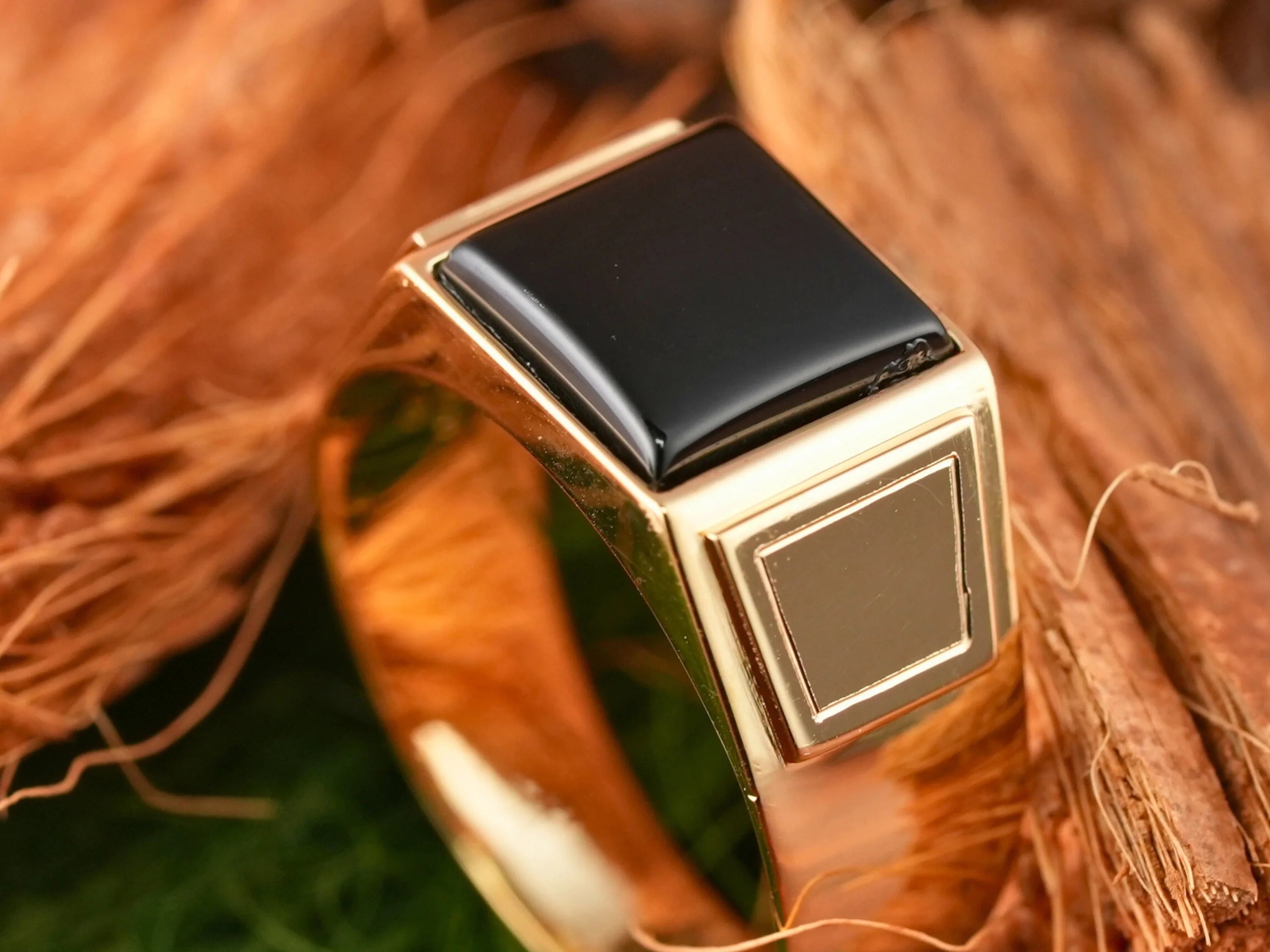 Gold ring with sculpted black onyx stone from Dominus Ring men’s 18K gold collection