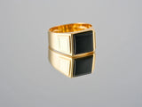 Men’s 18K gold Dominus Ring with sculpted black onyx signet stone
