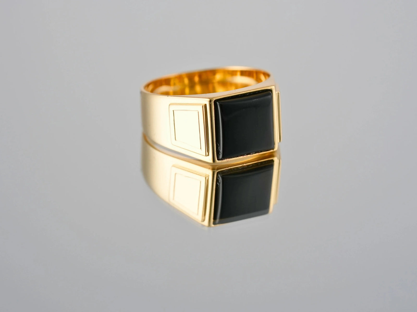 Men’s 18K gold Dominus Ring with sculpted black onyx signet stone