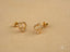 Gold CZ Heart earrings in double love art gold jewelry display with sparkling stones