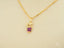 Dual Elegance Pendant featuring girl-shaped pendant in 18k solid gold with purple gemstones