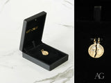 Dual Harmony two faces pendant: split gold coin forming a face in velvet box