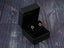 Gold-colored dual star earrings in open black jewelry box, part of certified 18k solid art gold jewelry
