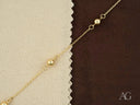 Delicate solid 18k gold bracelet with polished gold spheres