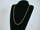 Elegant 14k gold rope chain necklace with secure barrel lock on black stand