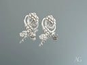 Elegant certified 18k solid gold floral diamond earrings with intricate silver-toned design