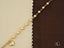 Gold-toned anklet with heart motif and polished gold beads in solid 18k gold