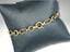 Elegant 18k gold bracelet with chain link design and spring ring clasp