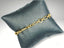 Elegant 18k gold bracelet featuring alternating oval and elongated links in solid gold